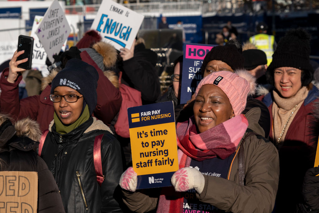 Nurses from the Royal College of Nursing strike for fair pay and working conditions in unprecedented industrial action by nurses outside the Queen Elizabeth Hospital on 15th December 2022 Birmingham