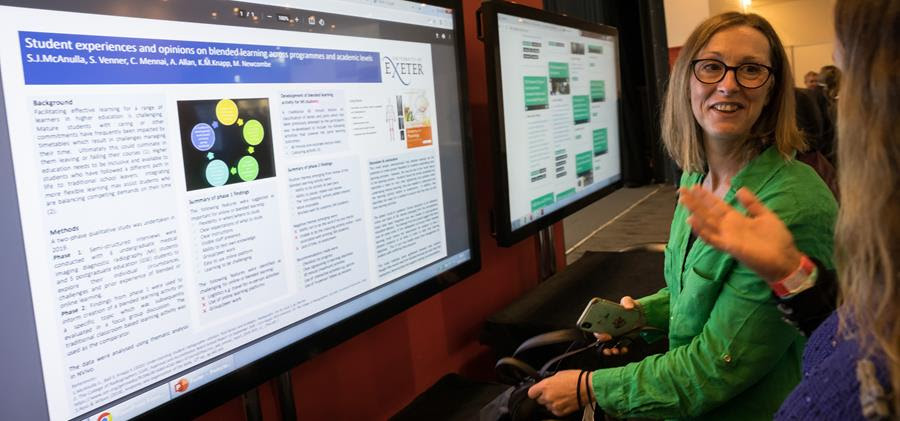 Delegates view posters at UKIO 2023