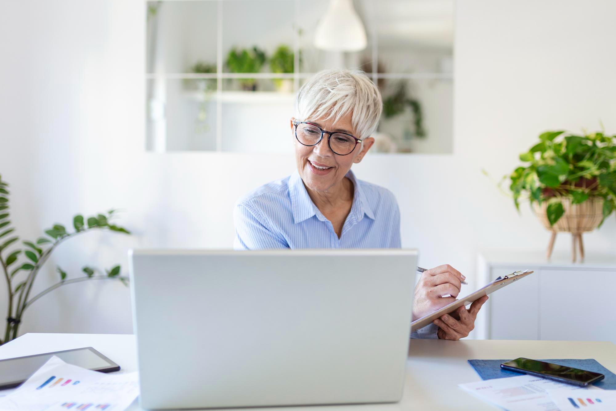 Happy woman working at laptop